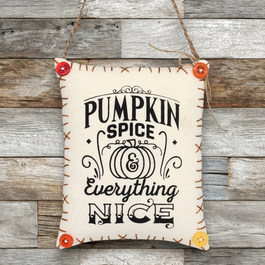 Fabric sign ornament that reads 'pumpkin spice and everything nice'