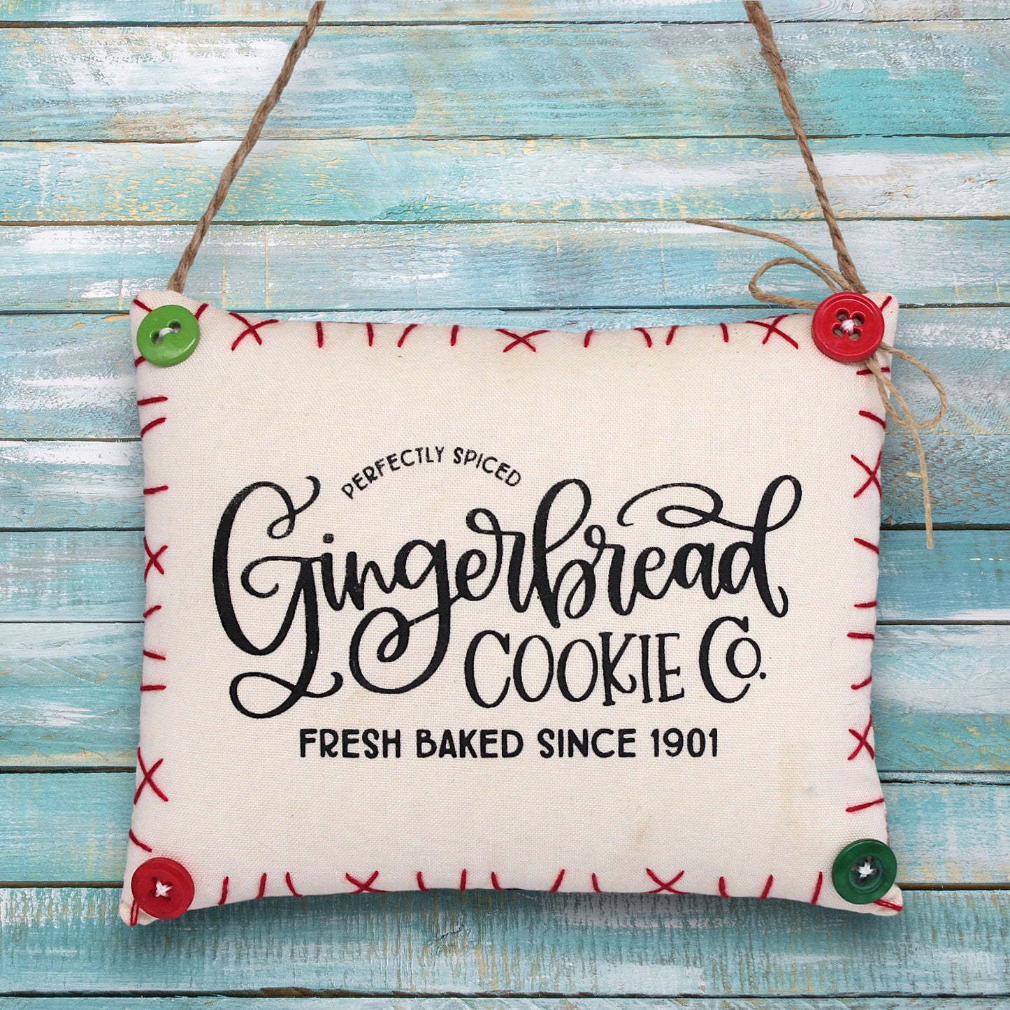 Decorative sign ornament for Gingerbread Cookie Co. on a wooden background