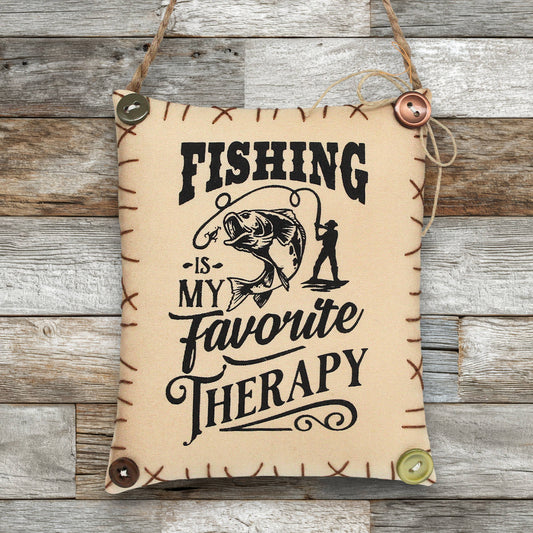 Decorative sign ornament with fishing-themed text on a wooden background