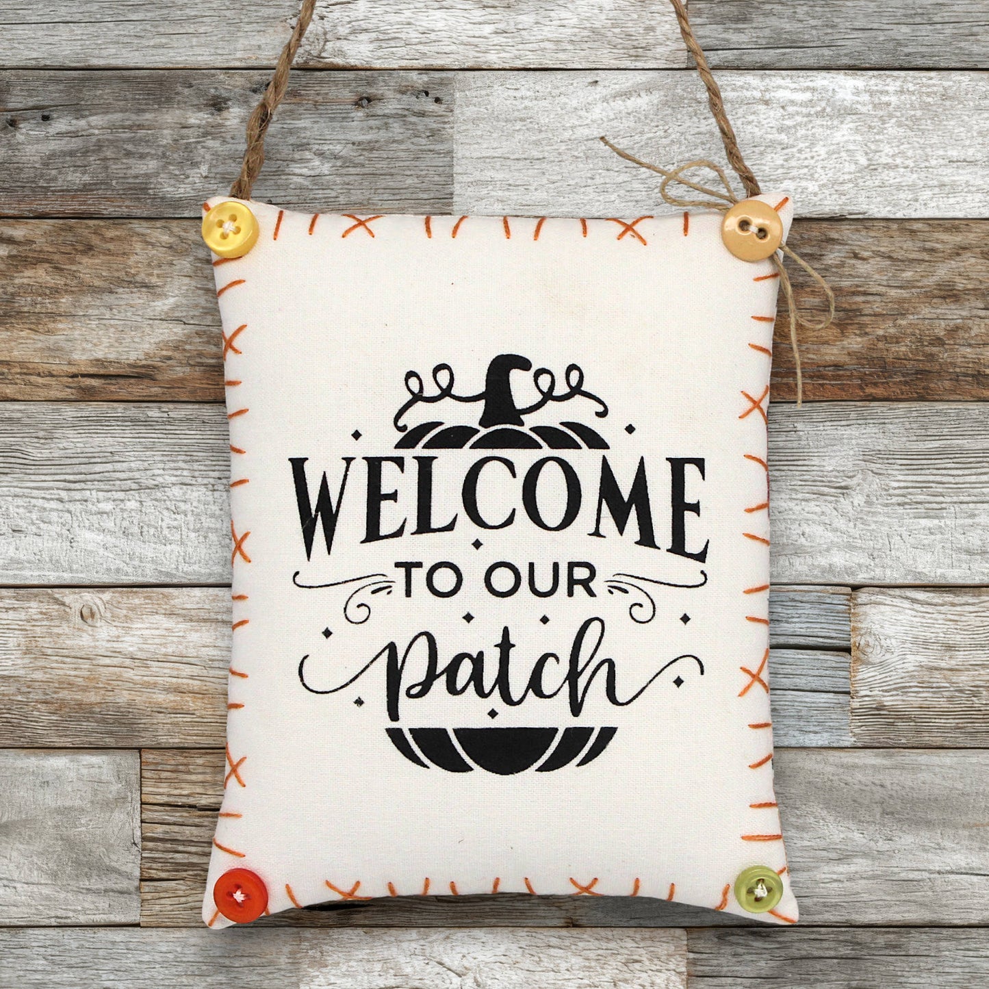 Decorative sign ornament with 'Welcome to our patch' text on a wooden background