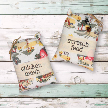 Two decorative grain sack bowl fillers with farm-themed designs and text on a wooden surface.