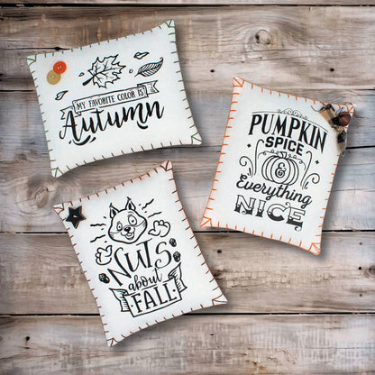 Set of three mini pillow bowl fillers screen-printed with autumn designs on white cotton