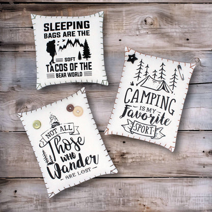 Set of three screen-printed mini pillows with adventure-themed designs for camping or cabin decorating