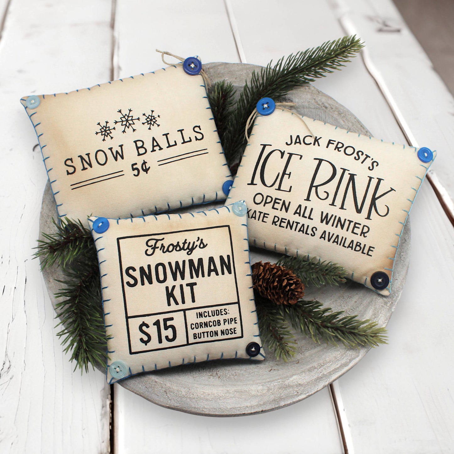 Set of three mini pillow bowl fillers with snowman designs