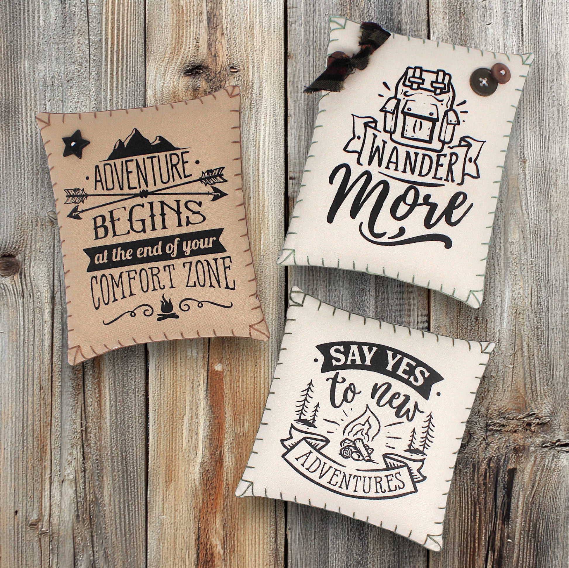 Set of three mini pillow bowl fillers with inspirational quotes about wandering and adventure