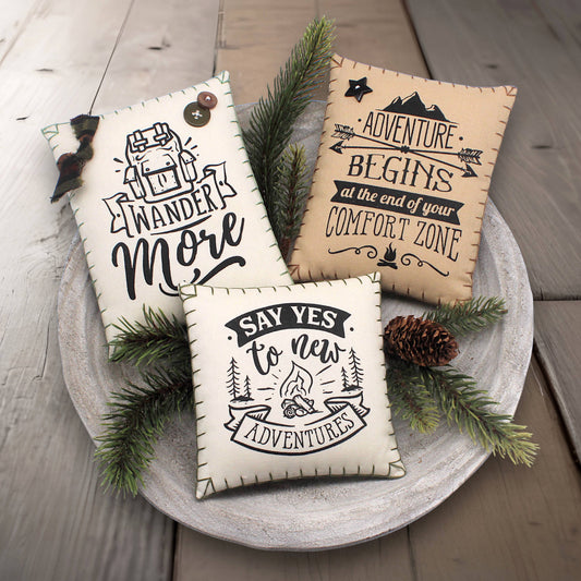 Set of three mini pillow bowl fillers with inspirational quotes about wandering and adventure