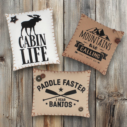 Set of three mini pillow bowl fillers with cabin and mountain-themed text and graphics
