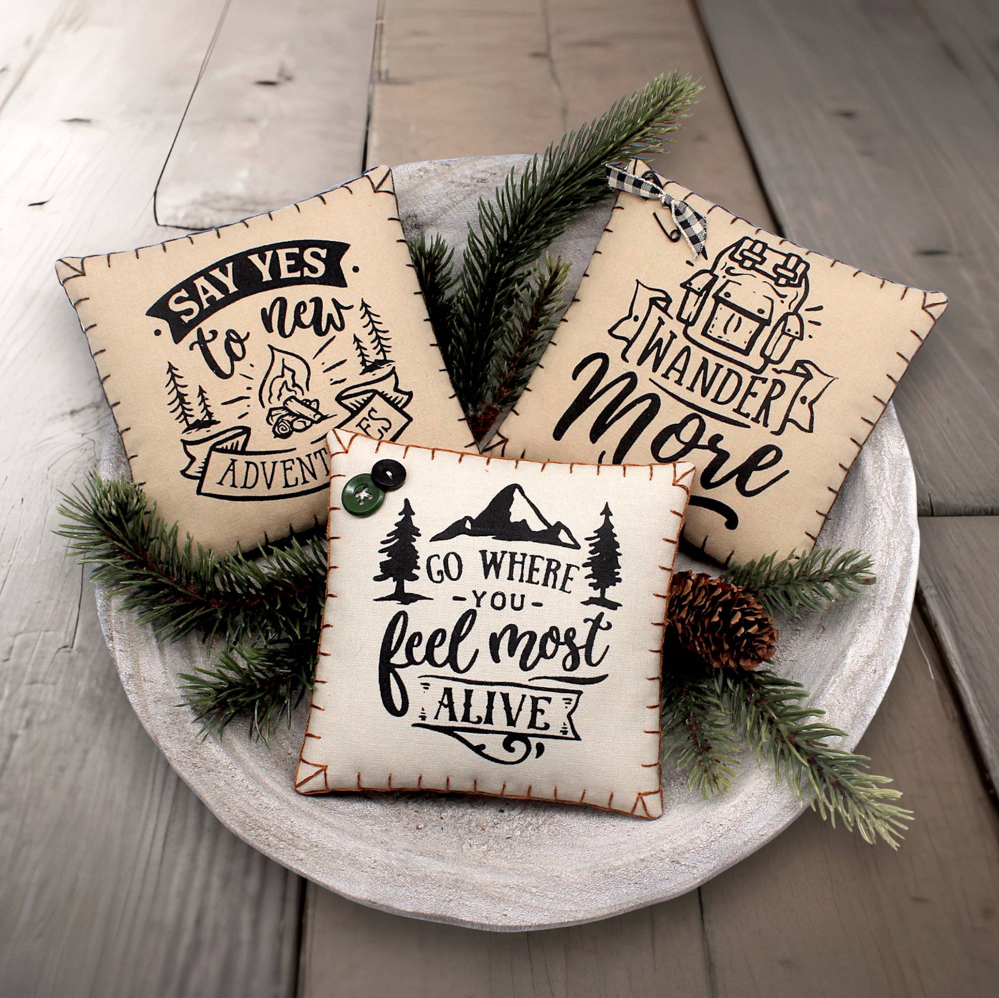 Set of three mini pillow bowl fillers with adventure and mountain cabin themed text