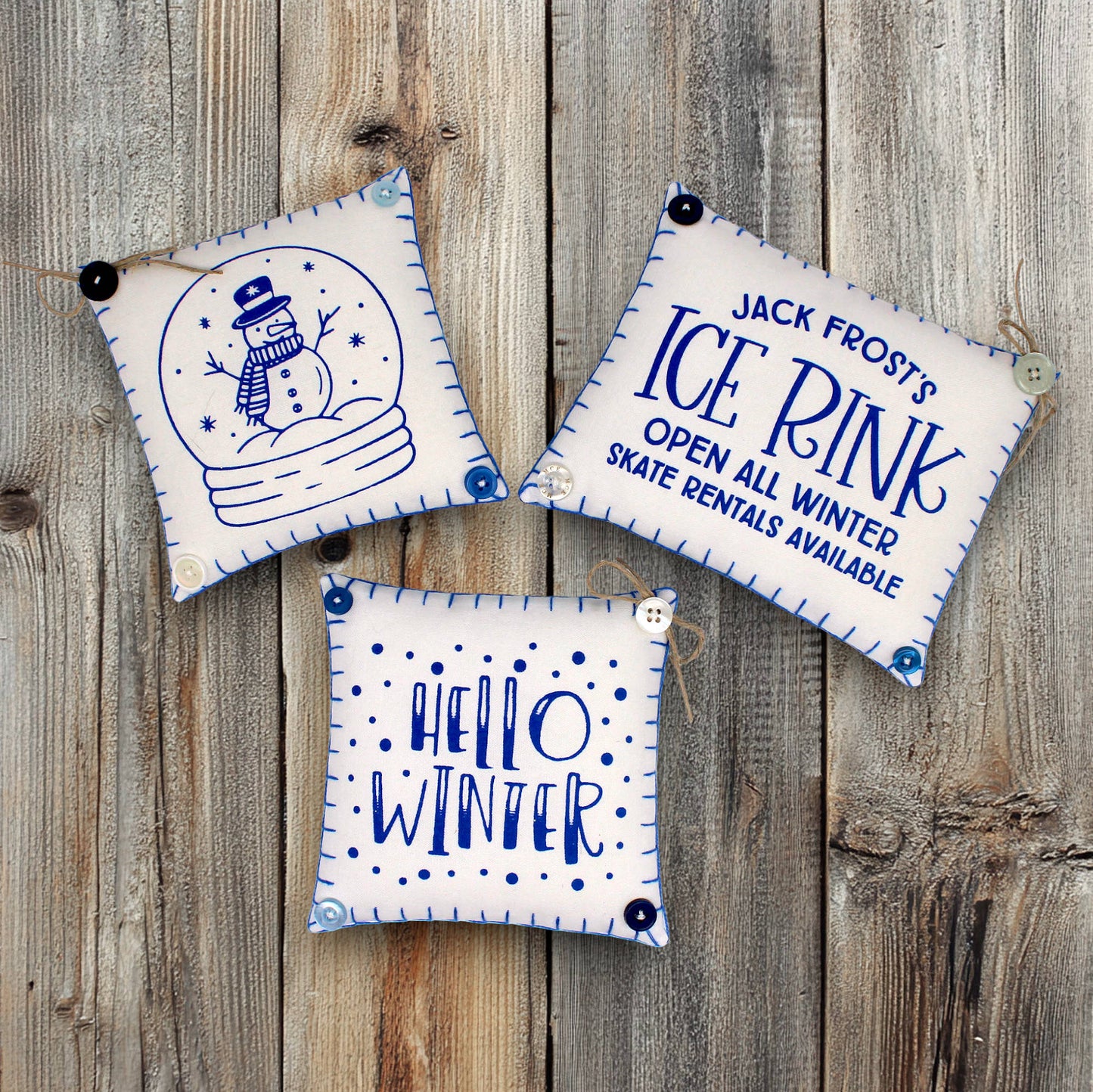 Set of three mini pillow bowl fillers with snowman and winter-themed text and graphics
