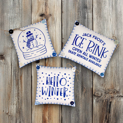 Set of three mini pillow bowl fillers with snowman and winter-themed text and graphics