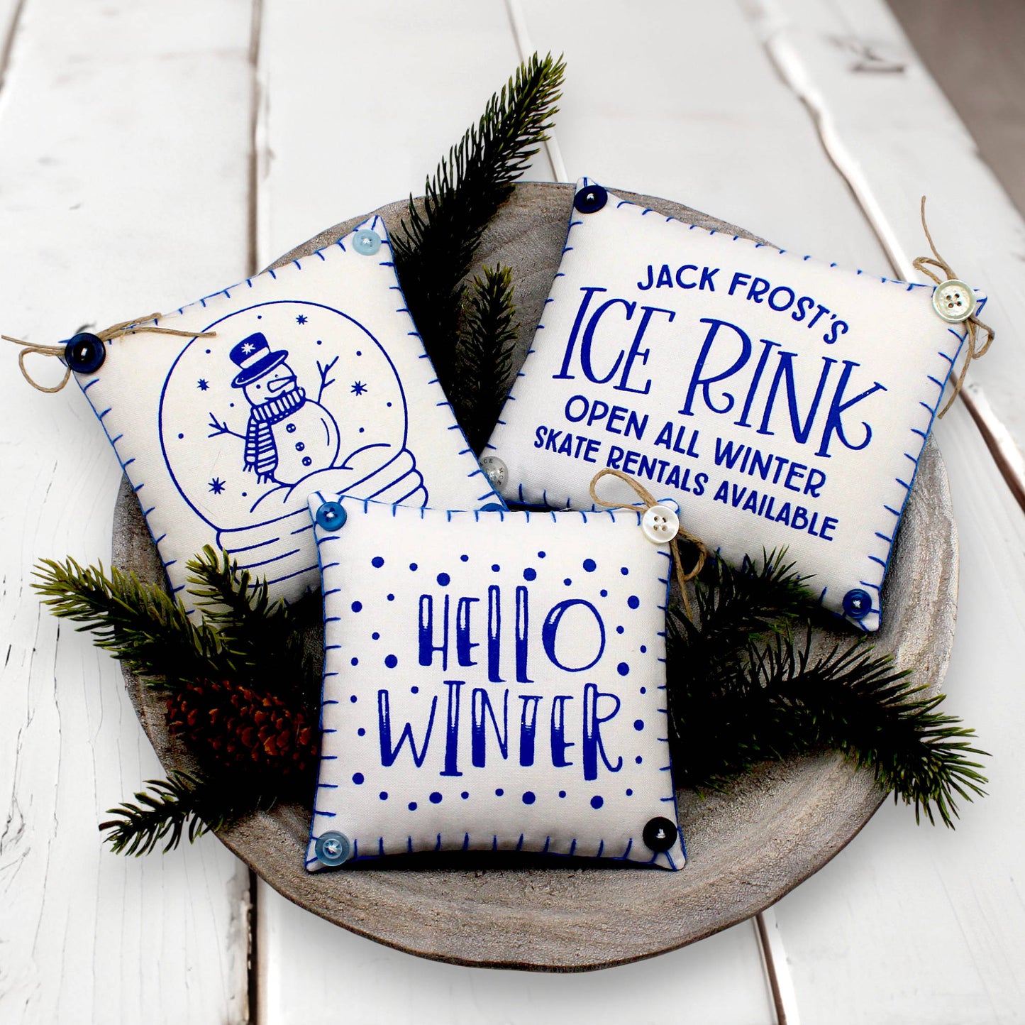 Set of three mini pillow bowl fillers with snowman and winter-themed text and graphics