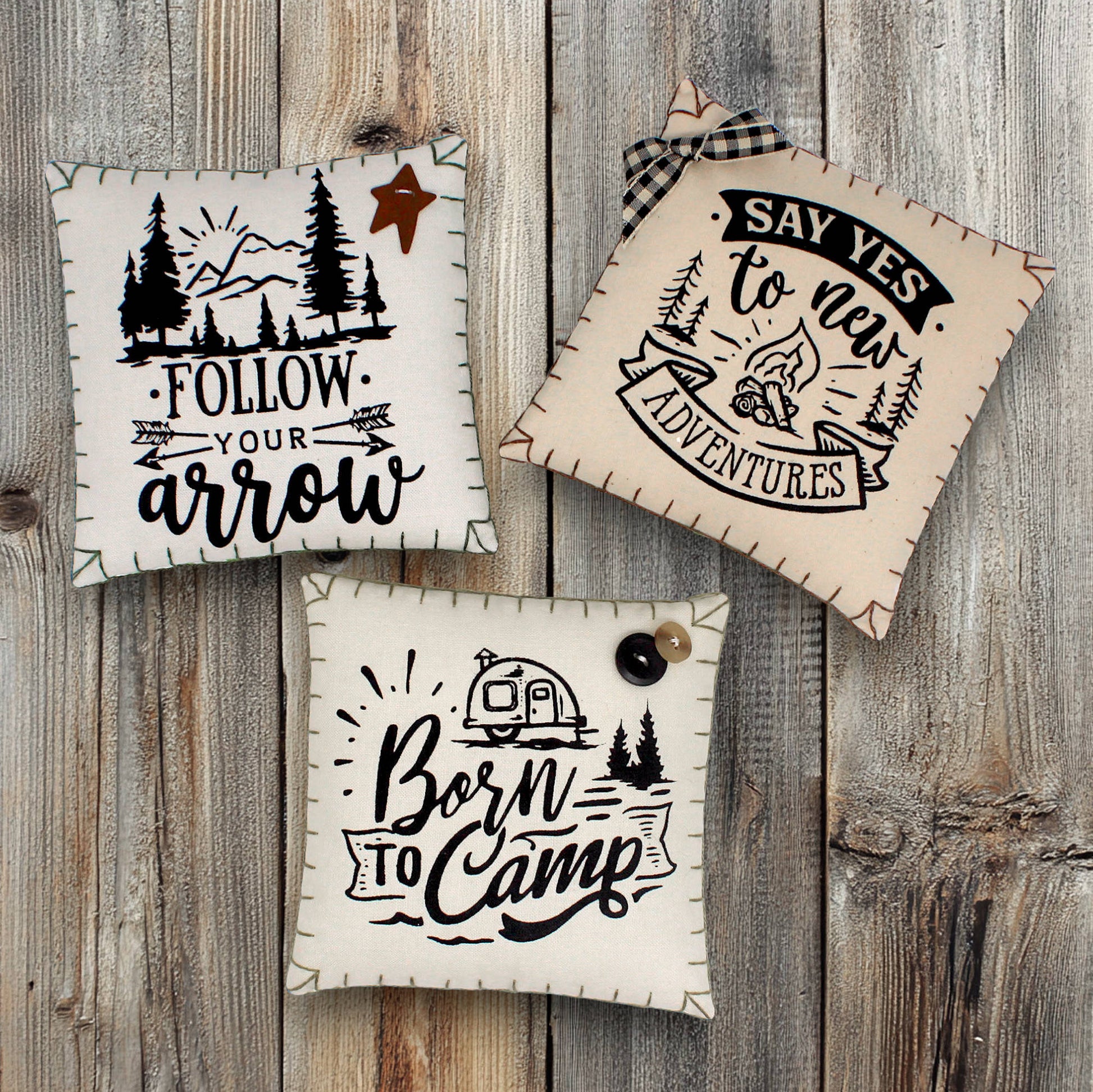 Set of three mini pillow bowl fillers with camping and adventure-themed text and graphics