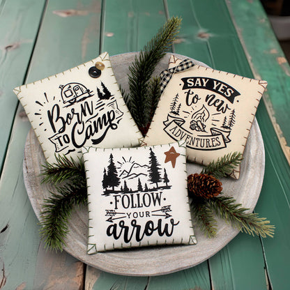 Set of three mini pillow bowl fillers with camping and adventure-themed text and graphics