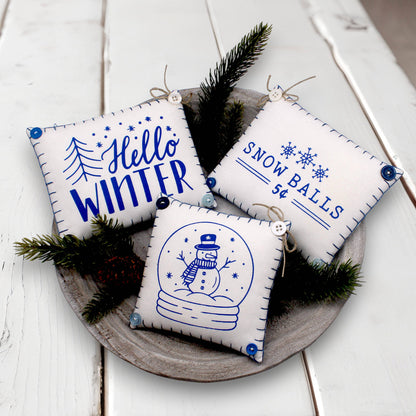 Set of three mini pillow bowl fillers with snowman and winter-themed text and graphics