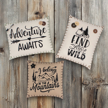 Set of three mini pillow bowl fillers with mountain cabin and adventure-themed text and graphics