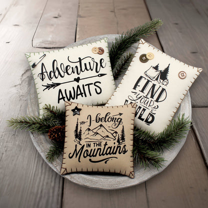 Set of three mini pillow bowl fillers with mountain cabin and adventure-themed text and graphics