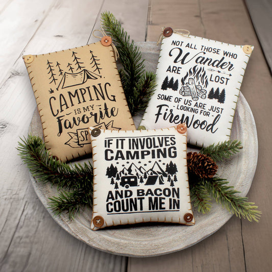 Set of three mini pillow bowl fillers with humorous quotes about camping