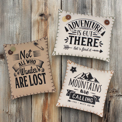 Set of three mini pillow bowl fillers with mountain and adventure-themed text and designs