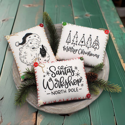 Set of three screen-printed mini pillow bowl fillers with Christmas themed text and designs