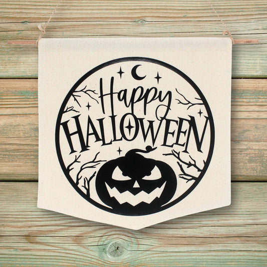 Decorative fabric wall banner with 'Happy Halloween' text and pumpkin design on a wooden background
