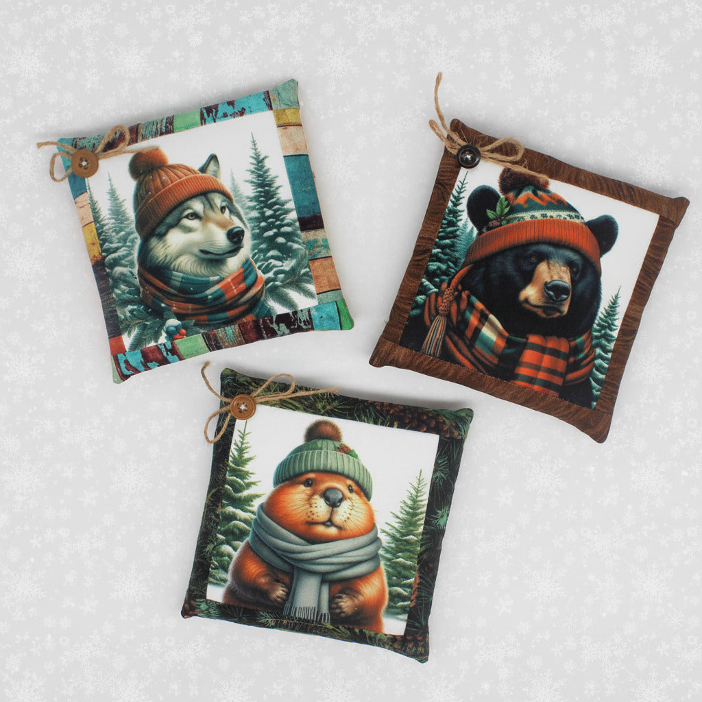 Three square miniature pillow bowl fillers with animal illustrations wearing hats and scarves on a white background.