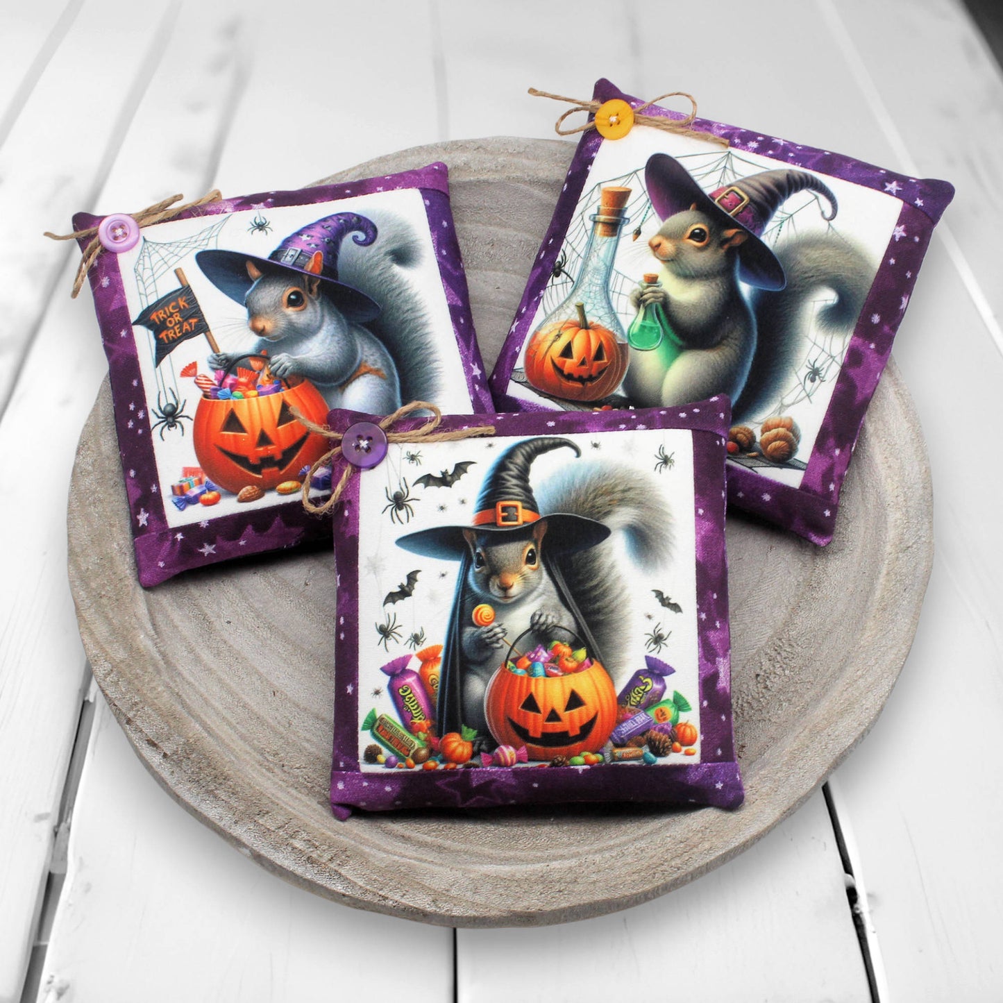 Set of three handmade miniature pillows with images of Halloween witch squirrels