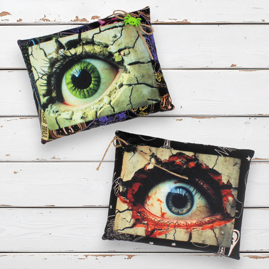 Set of two mini pillow bowl fillers with images of creepy eyes for Halloween decorating