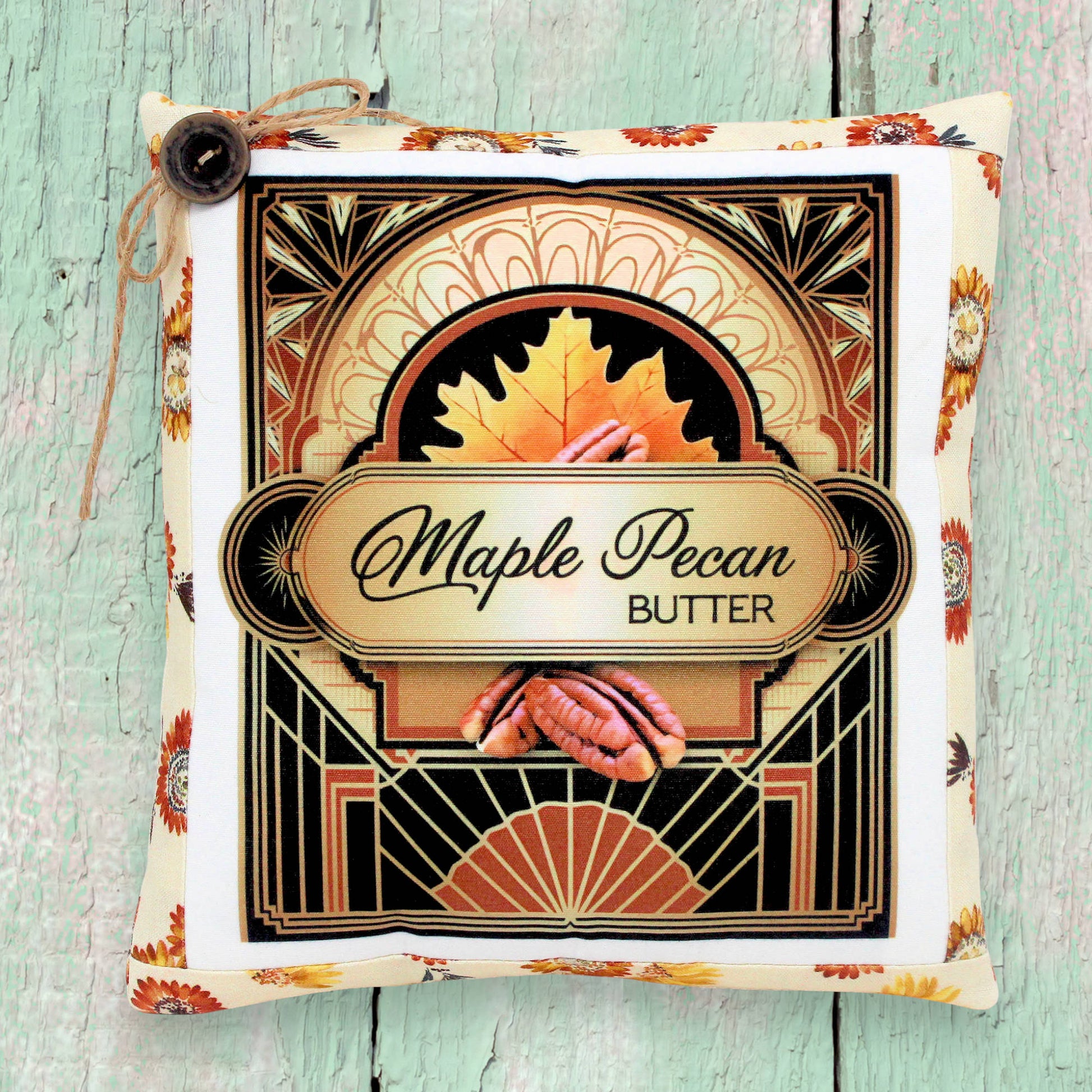 Decorative small autumn pillow with a maple pecan butter colorful design