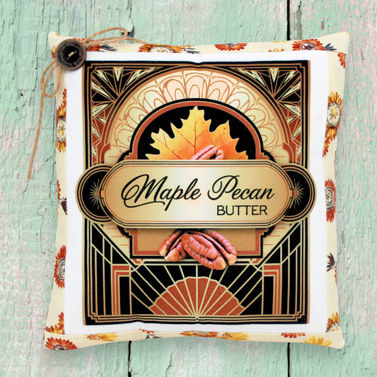 Decorative small autumn pillow with a maple pecan butter colorful design