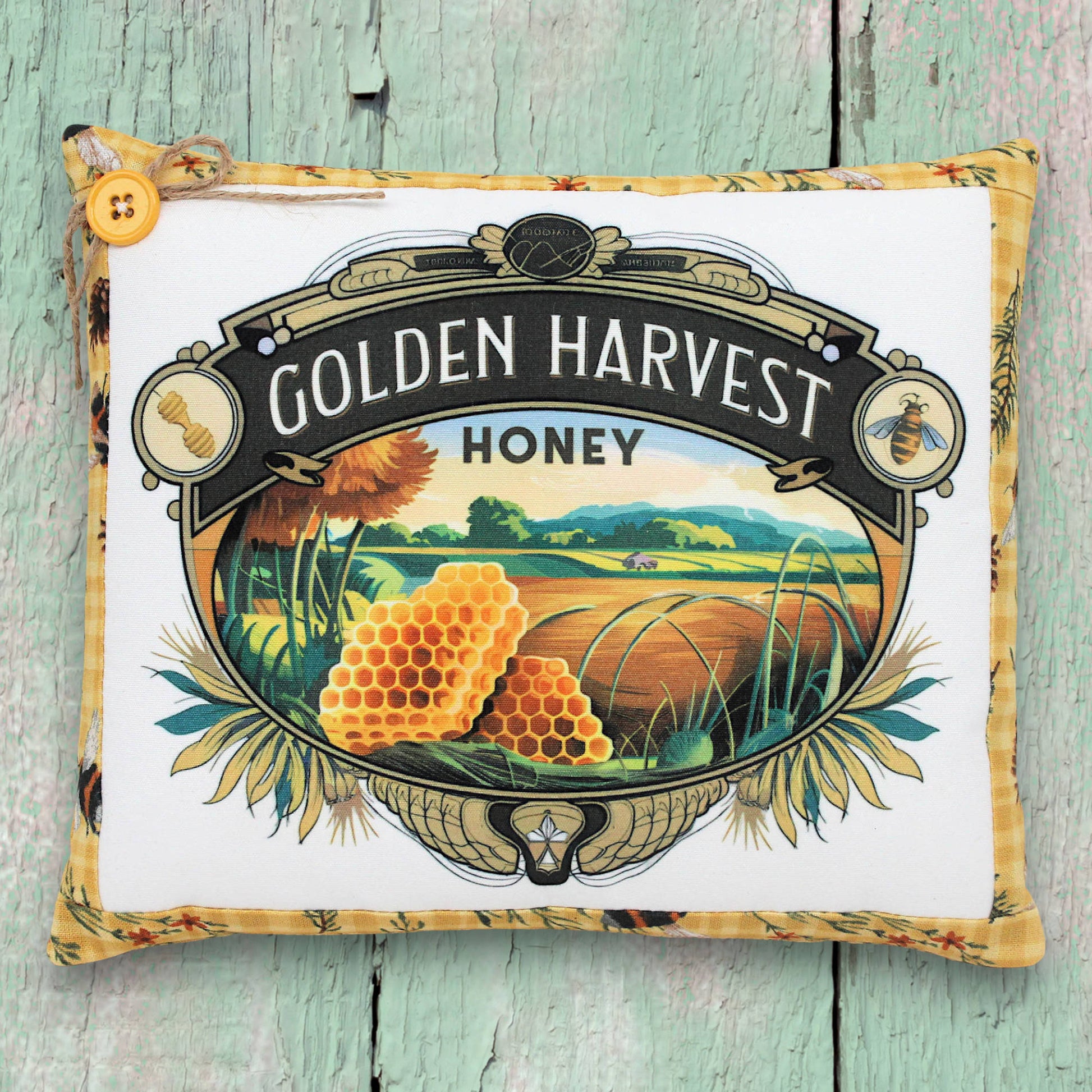 Decorative pillow with 'Golden Harvest Honey' design on a wooden surface