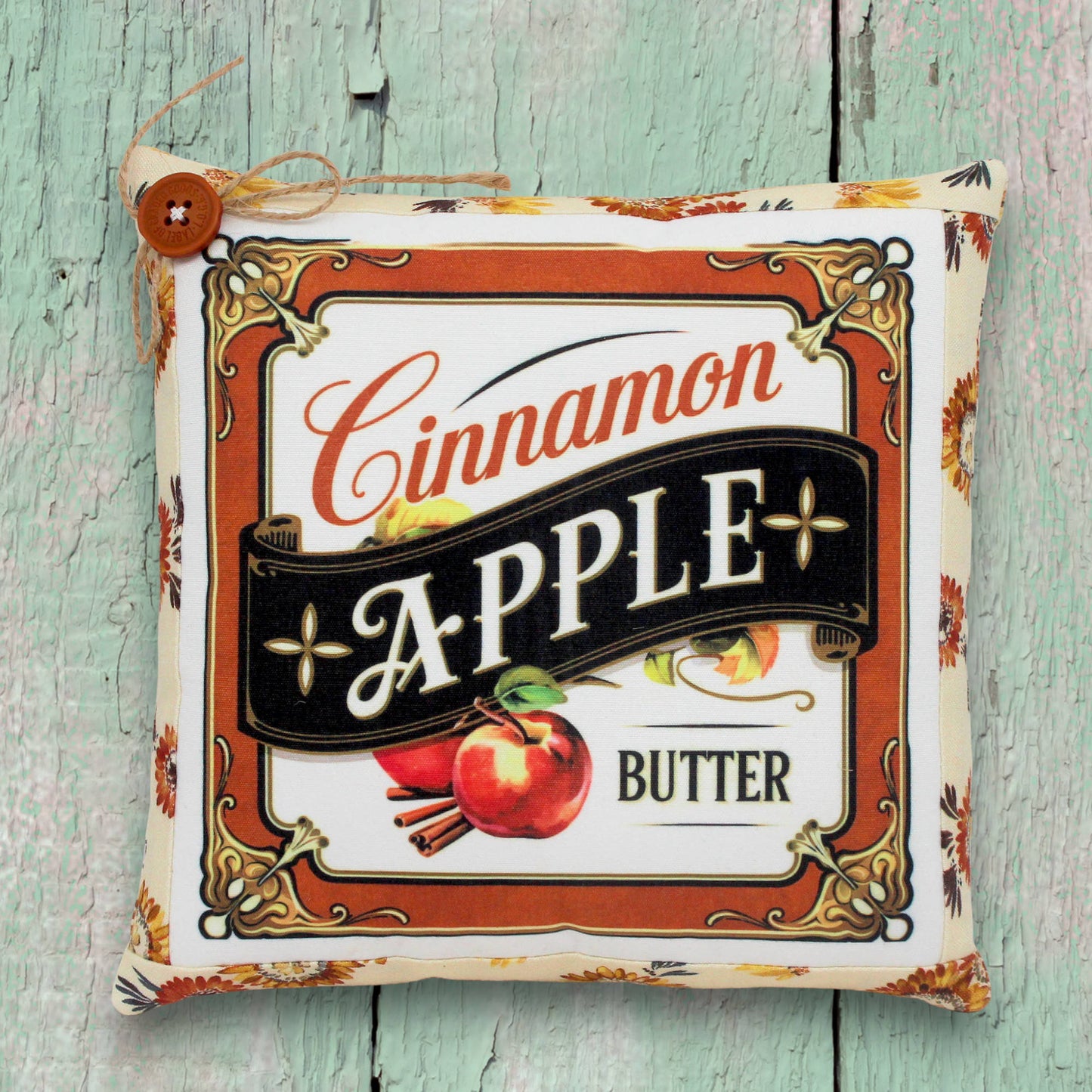 Decorative small pillow with a colorful cinnamon apple butter design