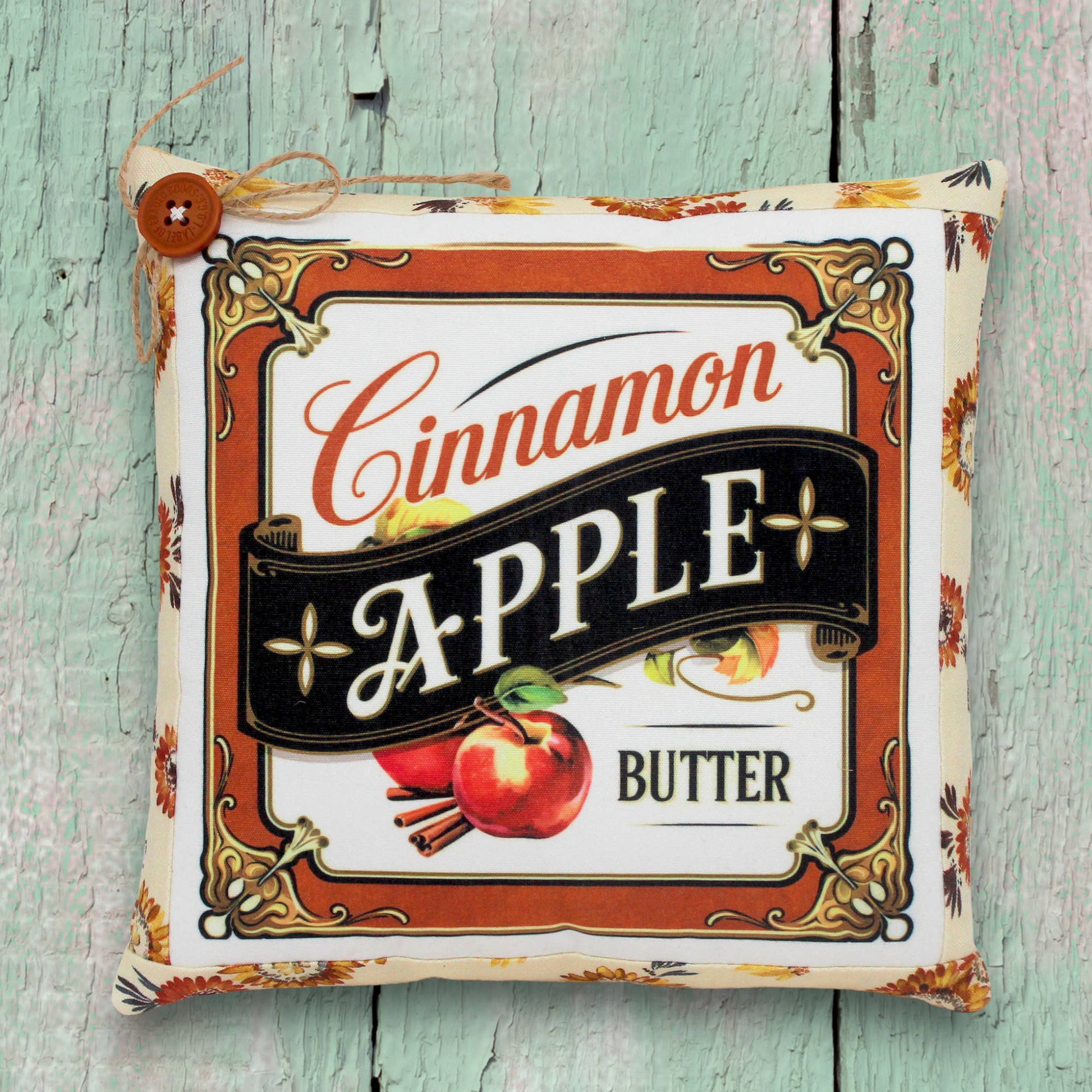 Decorative small pillow with a colorful cinnamon apple butter design