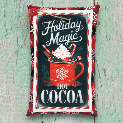 Mini pillow shelf sitter with a holiday magic hot cocoa desingn