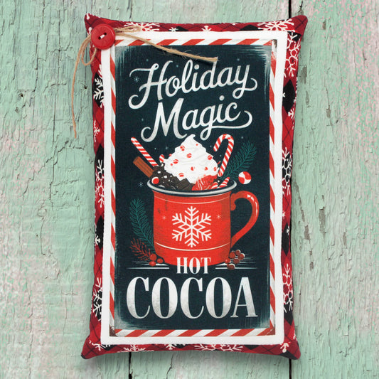Mini pillow shelf sitter with a holiday magic hot cocoa desingn