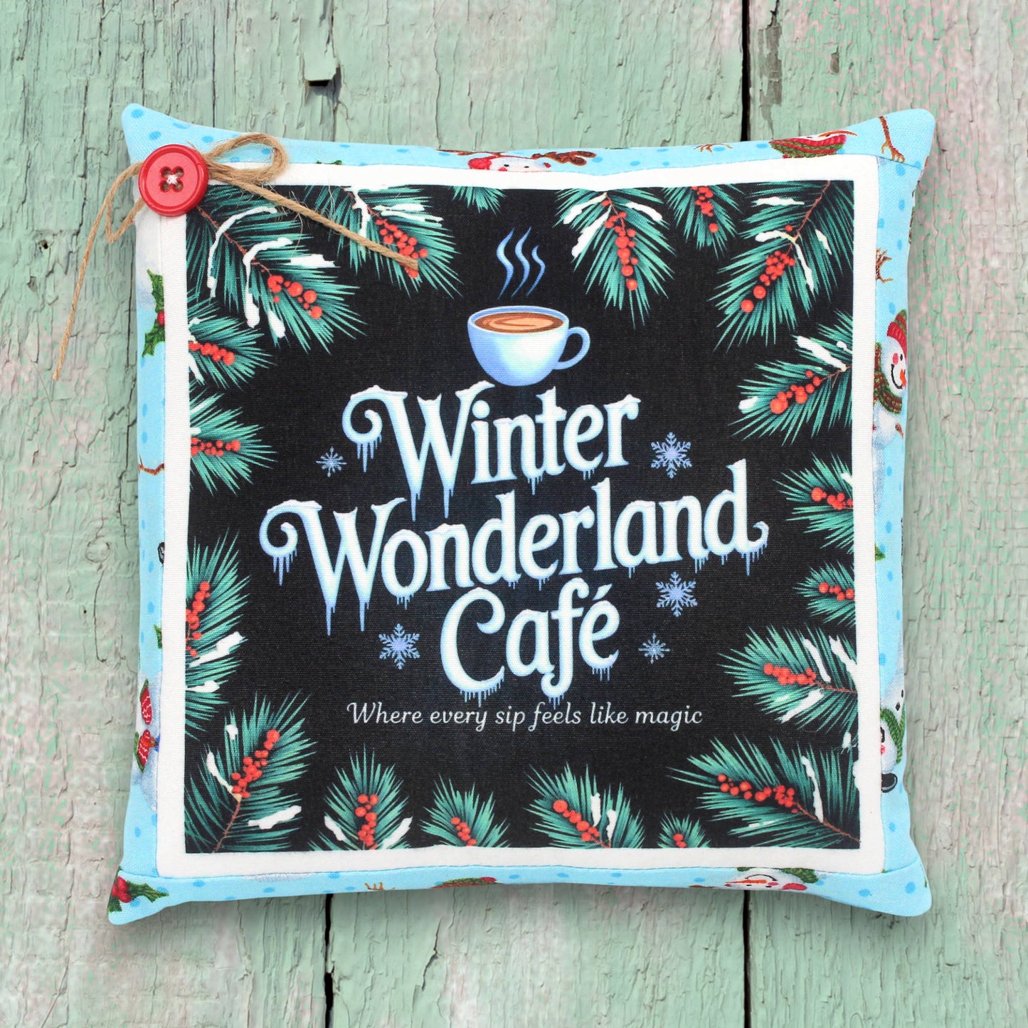 Decorative small pillow with a colorful Christmas winter wonderland cafe design