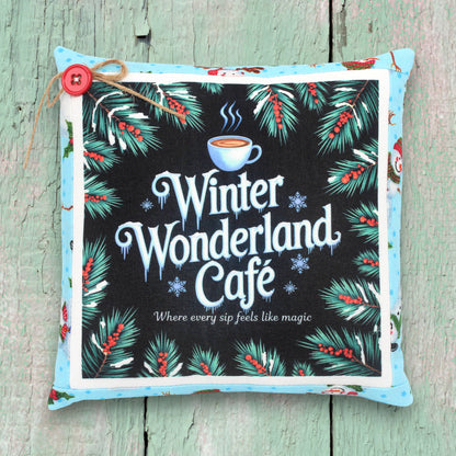 Decorative small pillow with a colorful Christmas winter wonderland cafe design
